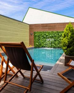 a hammock on a deck next to a swimming pool at Geonature in Macedo de Cavaleiros