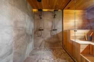 a bathroom with a shower and a sink at Villa Noel in Ylläsjärvi