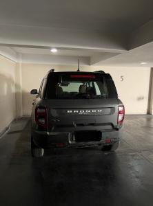 a gray suv parked in a parking garage at DEPARTAMENTO en MENDOZA centro, moderno y cálido, Parking - Lavandería in Mendoza