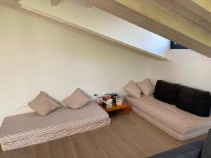 a living room with two couches and a table at La Llarena in La Isla