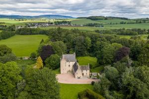 an aerial view of a castle in a field at Lickleyhead Castle in Insch