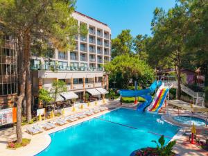 an image of a pool at a hotel with a slide at Pirates Park Resort - All Inclusive in Kemer