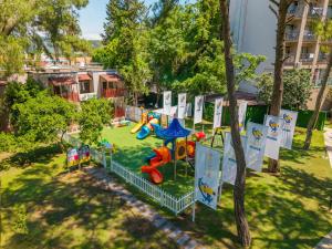 a park with a playground with a play equipment at Pirates Park Resort - All Inclusive in Kemer