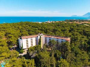 an aerial view of a building in the trees at Pirates Park Resort - All Inclusive in Kemer