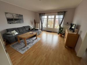 a living room with a couch and a table at Ferienwohnungen Camping SPO OHG in Böhl