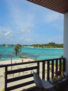 a view of the beach from the balcony of a resort at Valley Palm Seaview in Guraidhoo