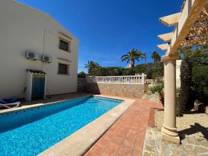 a swimming pool in front of a house at Casa Luis - Javea - Spanien in Jávea
