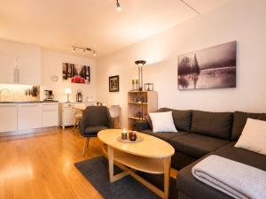 a living room with a couch and a table at Central Apartment in Geilo in Geilo