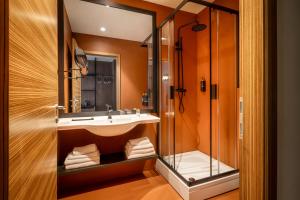 a bathroom with a sink and a shower at Remisens Hotel LUCIJA in Portorož