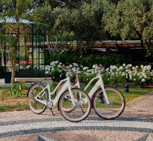 two bikes parked next to each other in a park at La Bastide de Saint Tropez in Saint-Tropez