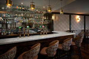 a bar with a bunch of bottles of alcohol at Killarney Towers Hotel & Leisure Centre in Killarney