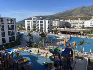 a view of a resort with a swimming pool at Palm Apartments Radhime in Vlorë