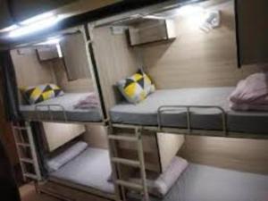a group of bunk beds in a room at abuzz oc shimla in Shimla