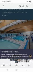 a screenshot of a swimming pool with the words swimming swim or call in to our at Driftmark Beachfront location Aberavon Beach Large Driveway parking 4 bed luxury contractor booking private site fibre optic wi fi in Port Talbot