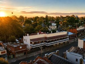 an aerial view of a city at sunset at The Old Vic Hotel in Canowindra