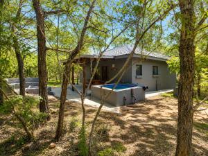 a house with a swimming pool in the yard at Maningwe in Marloth Park