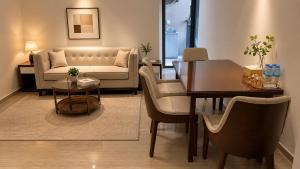 a living room with a couch and a table at Tian Yue Hotel in Phnom Penh