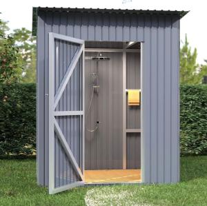 a shower shed with a door in the grass at Gyumri Glamping in Gyumri