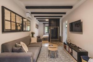 a living room with a couch and a table at Kami The Essence in Danilovgrad