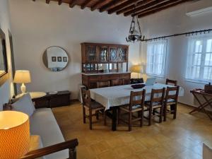 a dining room with a table and chairs at House in Kamares - Sifnos in Kamares