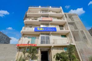 a building with a job tots sign on it at FabHotel HR Residency in New Delhi