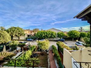 an apartment view of a parking lot with cars parked at Amazing house 10 minutes by car from the beach in Olbia