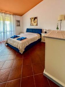 a bedroom with a bed in a room at Amazing house 10 minutes by car from the beach in Olbia