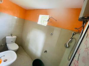 a bathroom with a toilet and a sink at Green views in Norton Bridge +2 photos