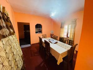 a dining room with a table and some chairs at Green views in Norton Bridge