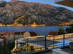 a view of a body of water with a mountain at Kotor Bay View Residence with Pool in Muo +18 photos