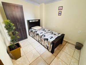 a bedroom with a bed in a room at Pousada e Pensionato Consuelo in Montes Claros