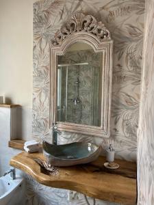 a bathroom with a sink and a mirror at B&B Casa CamiLory in San Lucido