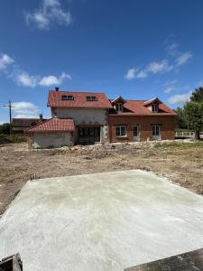 a house is under construction with a large concrete slab at La Grange aux Etangs - Les Chambres d'hôtes in Sennely