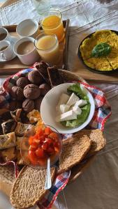 a plate of food with bread and vegetables on a table at B&B Casa CamiLory in San Lucido