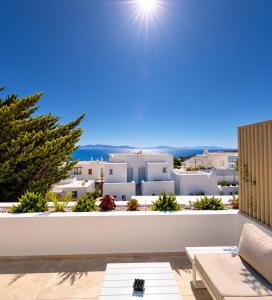 a view from the balcony of a villa with white buildings at MykoNest in Agios Stefanos
