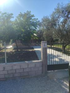 a gate in a park with a fence at Arethousa House in Nea Vrasna +8 photos