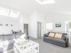 a living room with a couch and a table at High Trees View in Knaresborough