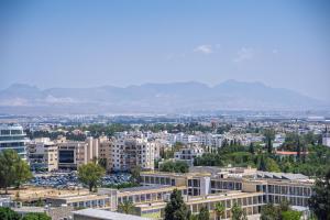 an aerial view of a city with buildings at Sky Suites Nicosia in Strovolos