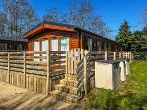 a wooden cabin with a fence in front of it at Phoenix - Uk49470 in Morpeth +5 photos