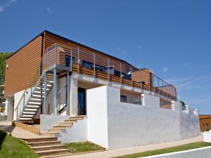 a house with a staircase on the side of it at Dunlin 4 - The Cove in Brixham