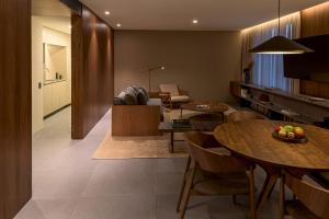 a kitchen and living room with a table and chairs at Hotel Fasano Sao Paulo Itaim in São Paulo
