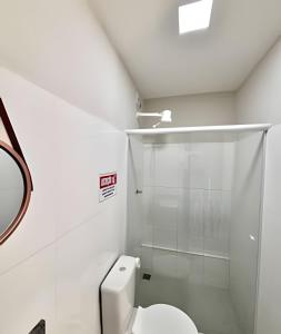 a bathroom with a toilet and a shower at Studio #3 Rubi in Campos dos Goytacazes