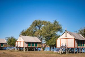 a playground with two houses and a slide at Chobe River Campsite in Ngoma