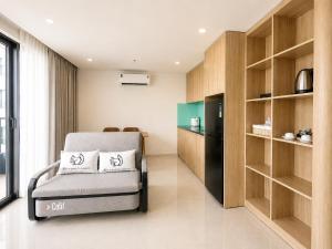 a living room with a chair in a room at Ngoc Thuong Hotel & Apartment- Han River View in Danang +31 photos