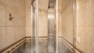 a shower with a glass door in a bathroom at Areos Polis Boutique Hotel in Areopoli +114 photos