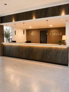 a hotel lobby with a hotel car rental counter at Hotel Cardal Tandil in Tandil