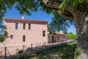 an old building with a tree in front of it at Villa Da Ella by IstriaLux in Krnica