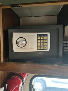 a safe on a shelf in a vehicle at Charmantes Oldtimer Wohnmobil in Aachen