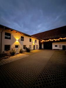 a lit up courtyard with a building with christmas lights at Wies'n Ruhe DTV 4-Sterne in Oberviechtach