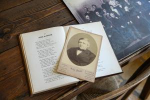 a book on a chair with a picture of a man at Walingsuites in Holwerd